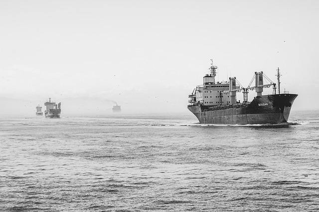 Container ship passing through English Channel with white cliffs of Dover in background